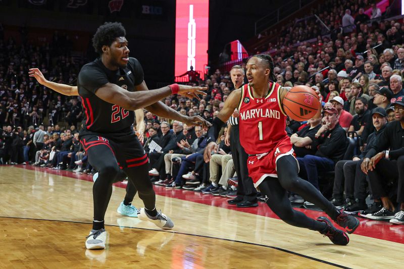 Feb 25, 2024; Piscataway, New Jersey, USA; Maryland Terrapins guard Jahmir Young (1) dribbles against Rutgers Scarlet Knights center Emmanuel Ogbole (22) during the first half at Jersey Mike's Arena. Mandatory Credit: Vincent Carchietta-USA TODAY Sports