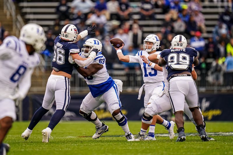 Sep 23, 2023; East Hartford, Connecticut, USA; Duke Blue Devils quarterback Riley Leonard (13) throws a pass against the UConn Huskies at Rentschler Field at Pratt & Whitney Stadium. Mandatory Credit: David Butler II-USA TODAY Sports