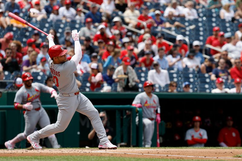 May 11, 2025; Washington, District of Columbia, USA; St. Louis Cardinals first base Willson Contreras (40) hits a solo home run against the Washington Nationals during the second inning at Nationals Park. Mandatory Credit: Geoff Burke-Imagn Images