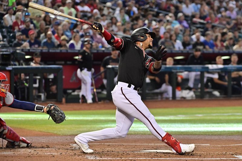 May 27, 2023; Phoenix, Arizona, USA;  Arizona Diamondbacks second baseman Ketel Marte (4) hits a solo home run against the Boston Red Sox in the first inning at Chase Field. Mandatory Credit: Matt Kartozian-USA TODAY Sports