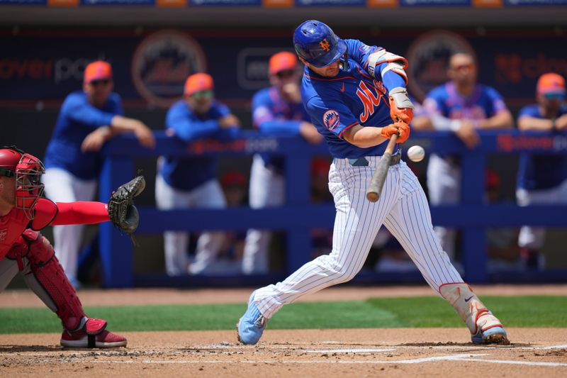 Mar 24, 2024; Port St. Lucie, Florida, USA;  New York Mets first baseman Pete Alonso (20) hits a single in the first inning against the Washington Nationals at Clover Park. Mandatory Credit: Jim Rassol-USA TODAY Sports