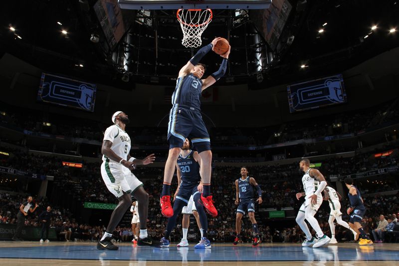 MEMPHIS, TN - OCTOBER 31: Jake LaRavia #3 of the Memphis Grizzlies rebounds the ball during the game against the Milwaukee Bucks on October 31, 2024 at FedExForum in Memphis, Tennessee. NOTE TO USER: User expressly acknowledges and agrees that, by downloading and or using this photograph, User is consenting to the terms and conditions of the Getty Images License Agreement. Mandatory Copyright Notice: Copyright 2024 NBAE (Photo by Joe Murphy/NBAE via Getty Images)