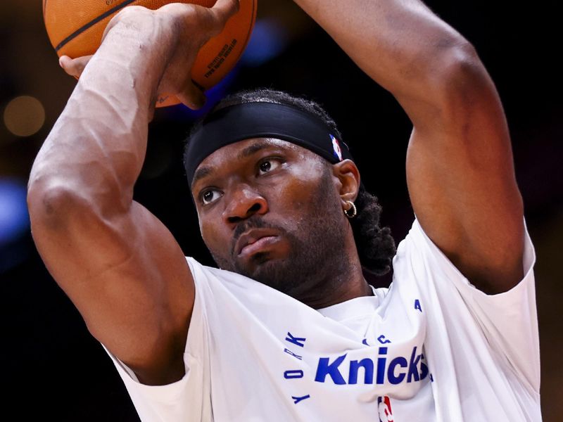 TORONTO, CANADA - DECEMBER 9: Precious Achiuwa #5 of the New York Knicks warms up before the game against the Toronto Raptors on December 9, 2024 at the Scotiabank Arena in Toronto, Ontario, Canada.  NOTE TO USER: User expressly acknowledges and agrees that, by downloading and or using this Photograph, user is consenting to the terms and conditions of the Getty Images License Agreement.  Mandatory Copyright Notice: Copyright 2024 NBAE (Photo by Vaughn Ridley/NBAE via Getty Images)