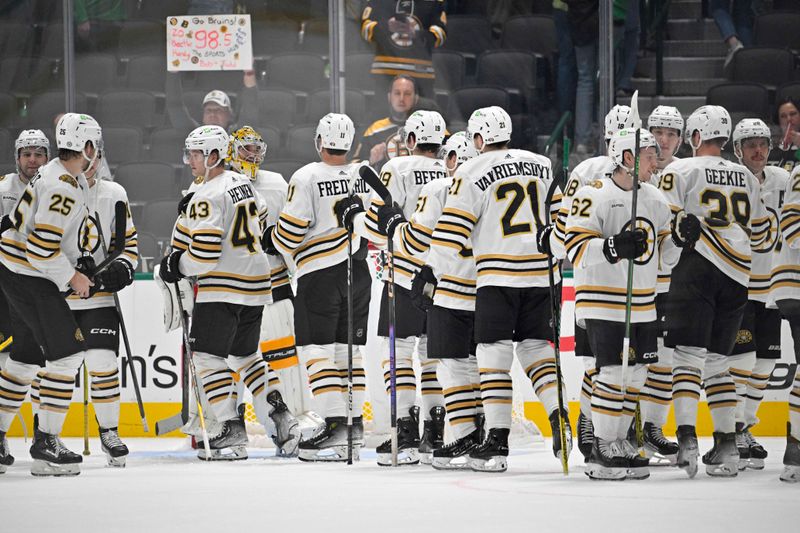 Nov 6, 2023; Dallas, Texas, USA; The Boston Bruins celebrate on the ice after the Bruins victory over the Dallas Stars at the American Airlines Center. Mandatory Credit: Jerome Miron-USA TODAY Sports