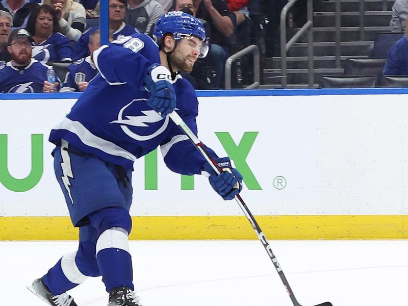 Jan 27, 2024; Tampa, Florida, USA; Tampa Bay Lightning left wing Brandon Hagel (38) scores a goal against the New Jersey Devils during the third period at Amalie Arena. Mandatory Credit: Kim Klement Neitzel-USA TODAY Sports