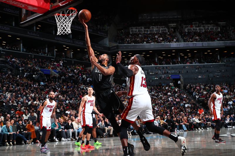 BROOKLYN, NY - JANUARY 15: Mikal Bridges #1 of the Brooklyn Nets drives to the basket during the game against the Miami Heat on January 15, 2024 at Barclays Center in Brooklyn, New York. NOTE TO USER: User expressly acknowledges and agrees that, by downloading and or using this Photograph, user is consenting to the terms and conditions of the Getty Images License Agreement. Mandatory Copyright Notice: Copyright 2024 NBAE (Photo by David Nemec/NBAE via Getty Images)