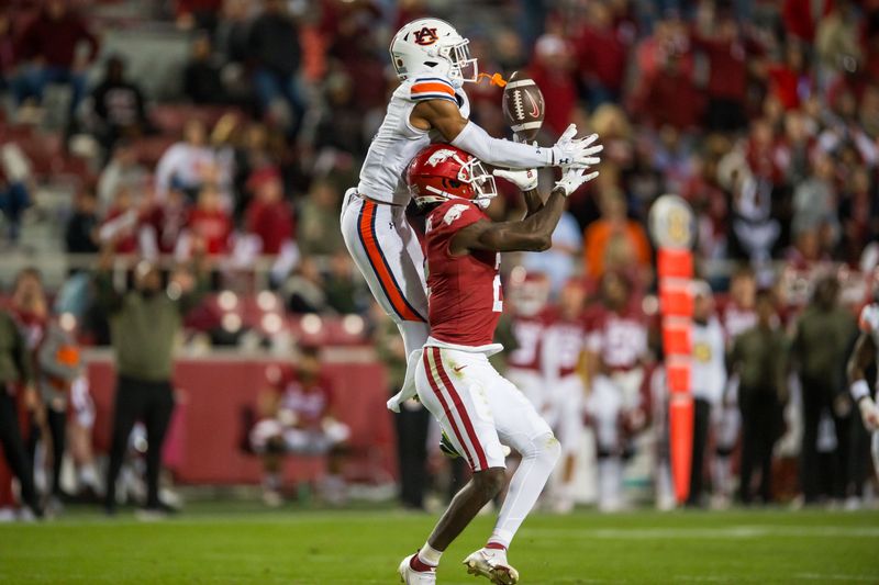 Nov 11, 2023; Fayetteville, Arkansas, USA;  Auburn Tigers cornerback Kayin Lee (3) breaks up a pass intended for Arkansas Razorbacks wide receiver Andrew Armstrong (2) during the fourth quarter at Donald W. Reynolds Razorback Stadium. Auburn won 48-10. Mandatory Credit: Brett Rojo-USA TODAY Sports