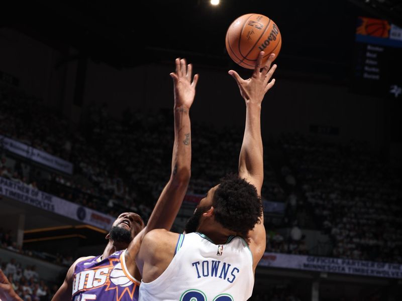 MINNEAPOLIS, MN -  APRIL 20: Karl-Anthony Towns #32 of the Minnesota Timberwolves drives to the basket during the game against the Phoenix Suns during Round 1 Game 1 of the 2024 NBA Playoffs on April 20, 2024 at Target Center in Minneapolis, Minnesota. NOTE TO USER: User expressly acknowledges and agrees that, by downloading and or using this Photograph, user is consenting to the terms and conditions of the Getty Images License Agreement. Mandatory Copyright Notice: Copyright 2024 NBAE (Photo by David Sherman/NBAE via Getty Images)