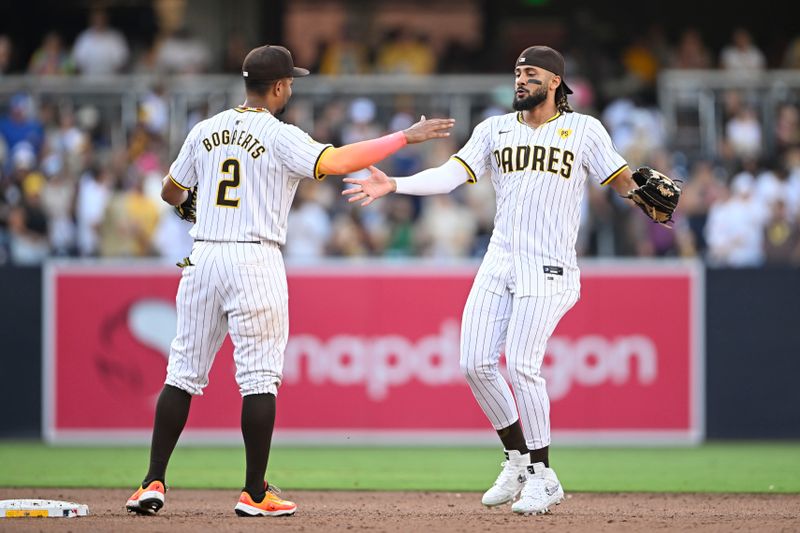 Sep 2, 2024; San Diego, California, USA; San Diego Padres right fielder Fernando Tatis Jr. (23), right, is congratulated by Xander Bogaerts (2) after the Padres beat the Detroit Tigers at Petco Park. Mandatory Credit: Denis Poroy-USA TODAY Sports