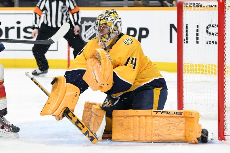 Jan 22, 2024; Nashville, Tennessee, USA; Nashville Predators goaltender Juuse Saros (74) makes a save during the second period against the Florida Panthers at Bridgestone Arena. Mandatory Credit: Christopher Hanewinckel-USA TODAY Sports