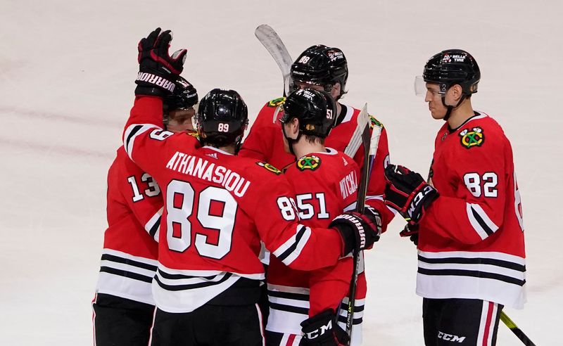 Jan 22, 2023; Chicago, Illinois, USA; Chicago Blackhawks defenseman Ian Mitchell (51) celebrates his goal against the Los Angeles Kings during the third period at United Center. Mandatory Credit: David Banks-USA TODAY Sports