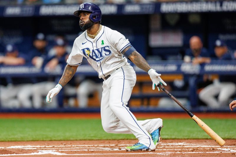 May 21, 2024; St. Petersburg, Florida, USA;  Tampa Bay Rays outfielder Randy Arozarena (56) hits a double against the Boston Red Sox in the first inning at Tropicana Field. Mandatory Credit: Nathan Ray Seebeck-USA TODAY Sports