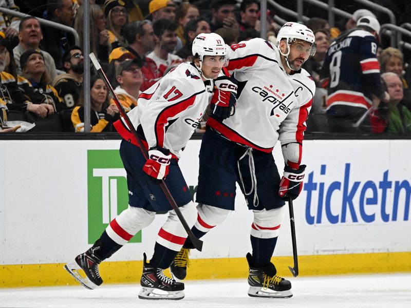 Feb 10, 2024; Boston, Massachusetts, USA; Washington Capitals center Dylan Strome (17) celebrates with left wing Alex Ovechkin (8) after scoring a goal against the Boston Bruins during the third period at the TD Garden. Mandatory Credit: Brian Fluharty-USA TODAY Sports