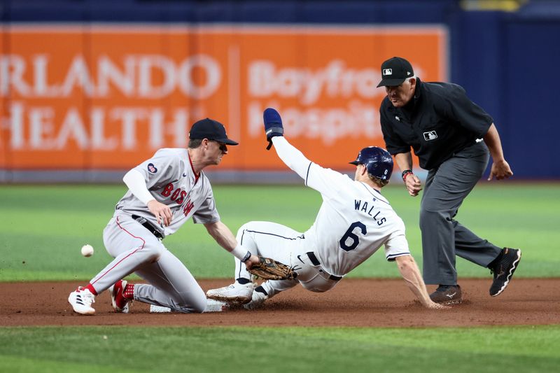 Sep 19, 2024; St. Petersburg, Florida, USA; Tampa Bay Rays shortstop Taylor Walls (6) steals second base on a errant throw to Boston Red Sox second baseman Nick Sogard (75) in the seventh inning at Tropicana Field. Mandatory Credit: Nathan Ray Seebeck-Imagn Images