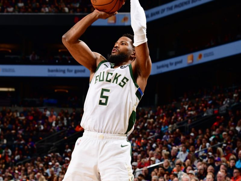 PHOENIX, AZ - FEBRUARY 6:  Malik Beasley #5 of the Milwaukee Bucks shoots a three point basket during the game  on February 6, 2024 at Footprint Center in Phoenix, Arizona. NOTE TO USER: User expressly acknowledges and agrees that, by downloading and or using this photograph, user is consenting to the terms and conditions of the Getty Images License Agreement. Mandatory Copyright Notice: Copyright 2024 NBAE (Photo by Barry Gossage/NBAE via Getty Images)