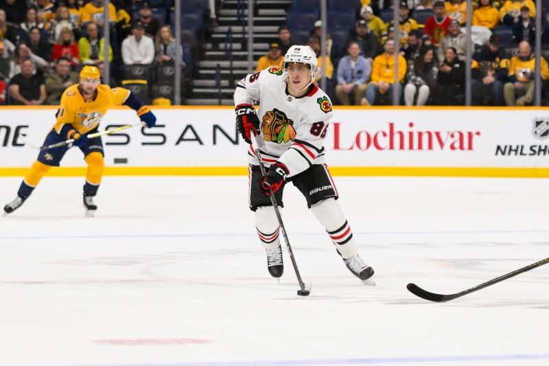 Jan 16, 2025; Nashville, Tennessee, USA;  Chicago Blackhawks center Teuvo Teravainen (86) skates with the puck against the Nashville Predators during the second period at Bridgestone Arena. Mandatory Credit: Steve Roberts-Imagn Images