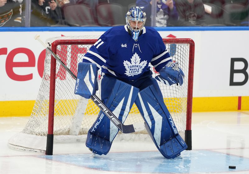 Dec 6, 2024; Toronto, Ontario, CAN;  Toronto Maple Leafs goaltender Anthony Stolarz (41) takes pucks during the warmup before a game against the Washington Capitals at Scotiabank Arena. Mandatory Credit: Nick Turchiaro-Imagn Images