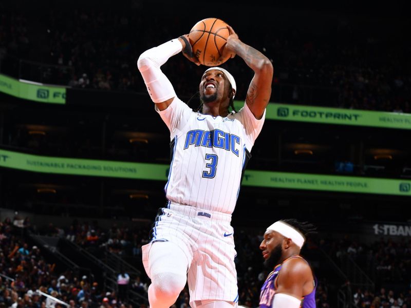 PHOENIX, AZ - NOVEMBER 18: Kentavious Caldwell-Pope #3 of the Orlando Magic dunks the ball during the game against the Phoenix Suns on November 18, 2024 at Footprint Center in Phoenix, Arizona. NOTE TO USER: User expressly acknowledges and agrees that, by downloading and or using this photograph, user is consenting to the terms and conditions of the Getty Images License Agreement. Mandatory Copyright Notice: Copyright 2024 NBAE (Photo by Barry Gossage/NBAE via Getty Images)