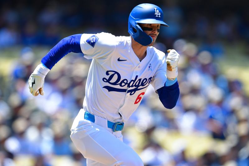 Jun 16, 2024; Los Angeles, California, USA; Los Angeles Dodgers third baseman Cavan Biggio (6) runs to first after hitting a single against the Kansas City Royals during the second inning at Dodger Stadium. Mandatory Credit: Gary A. Vasquez-USA TODAY Sports