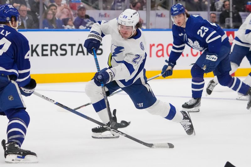 Apr 3, 2024; Toronto, Ontario, CAN; Tampa Bay Lightning forward Michael Eyssimont (23) shoots the puck against the Toronto Maple Leafs during the third period at Scotiabank Arena. Mandatory Credit: John E. Sokolowski-USA TODAY Sports