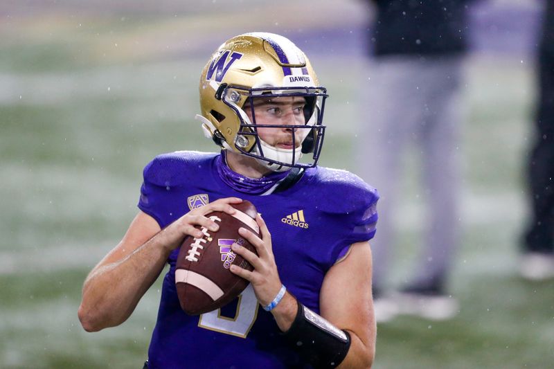 Nov 14, 2020; Seattle, Washington, USA; Washington Huskies quarterback Dylan Morris (9) throws during pregame warmups at Alaska Airlines Field at Husky Stadium. Mandatory Credit: Joe Nicholson-USA TODAY Sports