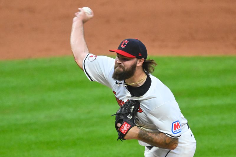 May 6, 2024; Cleveland, Ohio, USA; Cleveland Guardians relief pitcher Hunter Gaddis (33) delivers a pitch in the eighth inning against the Detroit Tigers at Progressive Field. Mandatory Credit: David Richard-USA TODAY Sports