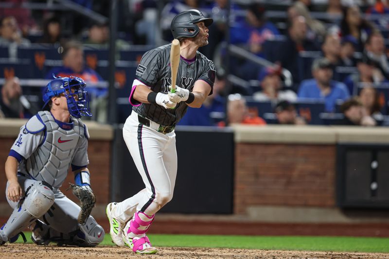 May 25, 2025; New York City, New York, USA;  New York Mets second baseman Jeff McNeil (1) hits a double during the sixth inning against the Los Angeles Dodgers at Citi Field. Mandatory Credit: Vincent Carchietta-Imagn Images