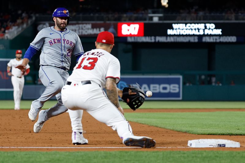 Jun 3, 2024; Washington, District of Columbia, USA; New York Mets designated hitter J.D. Martinez (28) runs to third base en route to scoring a run as a throw to Washington Nationals third base Nick Senzel (13) gets away during the sixth inning at Nationals Park. Mandatory Credit: Geoff Burke-USA TODAY Sports