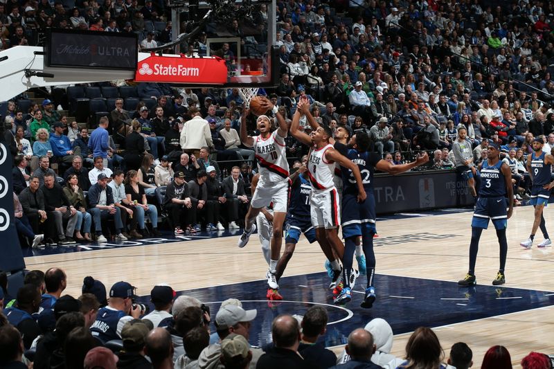 MINNEAPOLIS, MN -  MARCH 4: Moses Brown #10 of the Portland Trail Blazers grabs a rebound during the game against the Minnesota Timberwolves on March 4, 2024 at Target Center in Minneapolis, Minnesota. NOTE TO USER: User expressly acknowledges and agrees that, by downloading and or using this Photograph, user is consenting to the terms and conditions of the Getty Images License Agreement. Mandatory Copyright Notice: Copyright 2024 NBAE (Photo by David Sherman/NBAE via Getty Images)