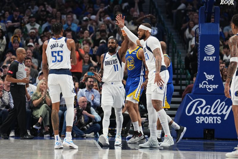 DALLAS, TX - MARCH 13: Kyrie Irving #11 of the Dallas Mavericks and Daniel Gafford #21 of the Dallas Mavericks high five during the game against the Golden State Warriors on March 13, 2024 at the American Airlines Center in Dallas, Texas. NOTE TO USER: User expressly acknowledges and agrees that, by downloading and or using this photograph, User is consenting to the terms and conditions of the Getty Images License Agreement. Mandatory Copyright Notice: Copyright 2024 NBAE (Photo by Glenn James/NBAE via Getty Images)