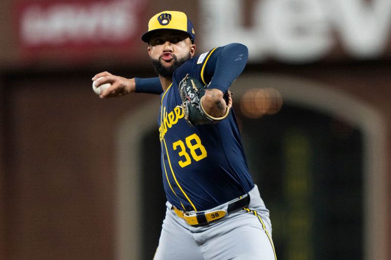 Sep 10, 2024; San Francisco, California, USA;  Milwaukee Brewers pitcher Devin Williams (38) pitches during the ninth inning against the San Francisco Giants at Oracle Park. Mandatory Credit: Stan Szeto-Imagn Images