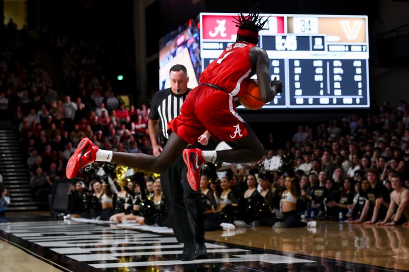 Alabama Crimson Tide forward Taylor Bol Bowen (7) dives for the loose ball and calls time out against the Vanderbilt Commodores Jan 7, 2026; Nashville, Tennessee, USA; during the first half at Memorial Gymnasium. Mandatory Credit: Steve Roberts-Imagn Images