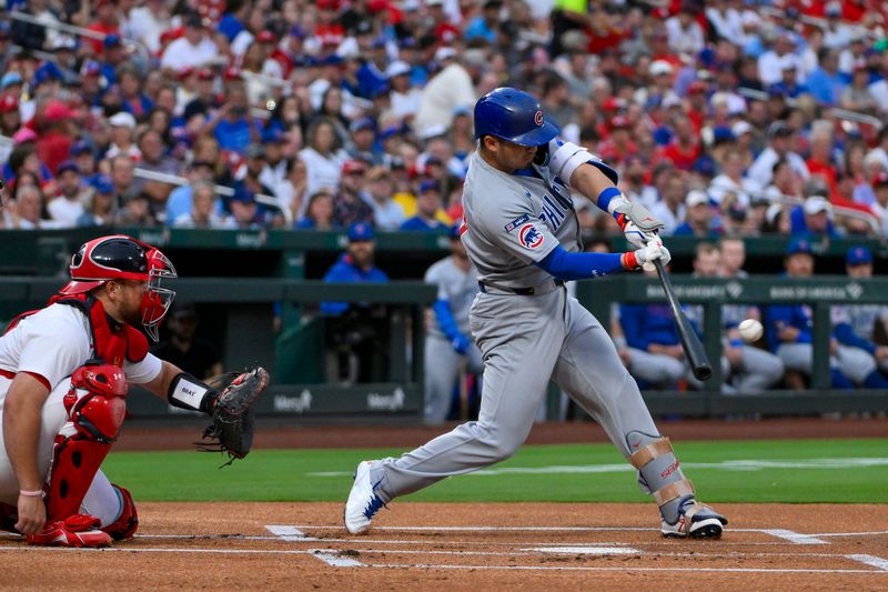 Aug 10, 2025; St. Louis, Missouri, USA;  Chicago Cubs designated hitter Seiya Suzuki (27) hits a single against the St. Louis Cardinals during the first inning at Busch Stadium. Mandatory Credit: Jeff Curry-Imagn Images