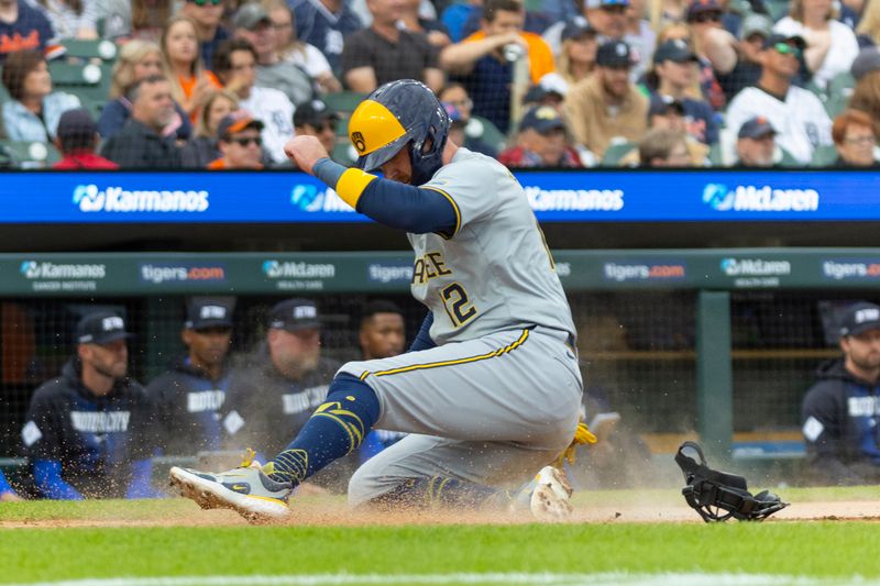 Jun 7, 2024; Detroit, Michigan, USA; Milwaukee Brewers first baseman Rhys Hoskins (12) scores a run during the second inning of the game against the Detroit Tigers at Comerica Park. Mandatory Credit: Brian Bradshaw Sevald-USA TODAY Sports