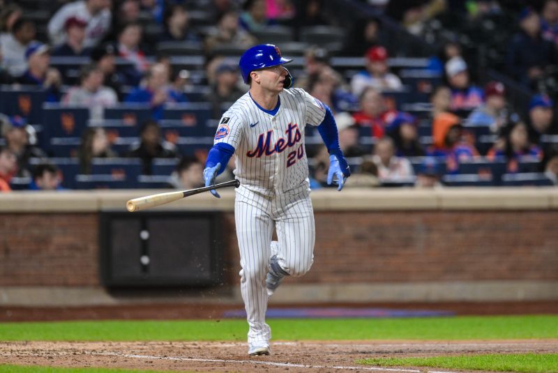 Apr 21, 2025; New York City, New York, USA; New York Mets first baseman Pete Alonso (20) hits a single against the Philadelphia Phillies during the sixth inning at Citi Field. Mandatory Credit: John Jones-Imagn Images
