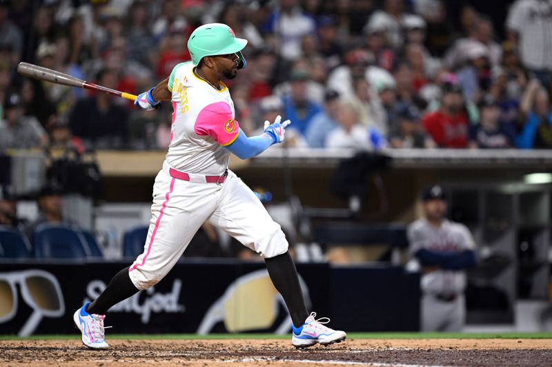 Jul 12, 2024; San Diego, California, USA; San Diego Padres second baseman Xander Bogaerts (2) hits a single against the Atlanta Braves during the ninth inning at Petco Park. Mandatory Credit: Orlando Ramirez-USA TODAY Sports 