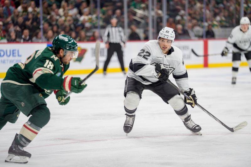 Oct 13, 2025; Saint Paul, Minnesota, USA; Los Angeles Kings left wing Kevin Fiala (22) and Minnesota Wild center Vinnie Hinostroza (18) chase a puck in the third period at Grand Casino Arena. Mandatory Credit: Matt Blewett-Imagn Images