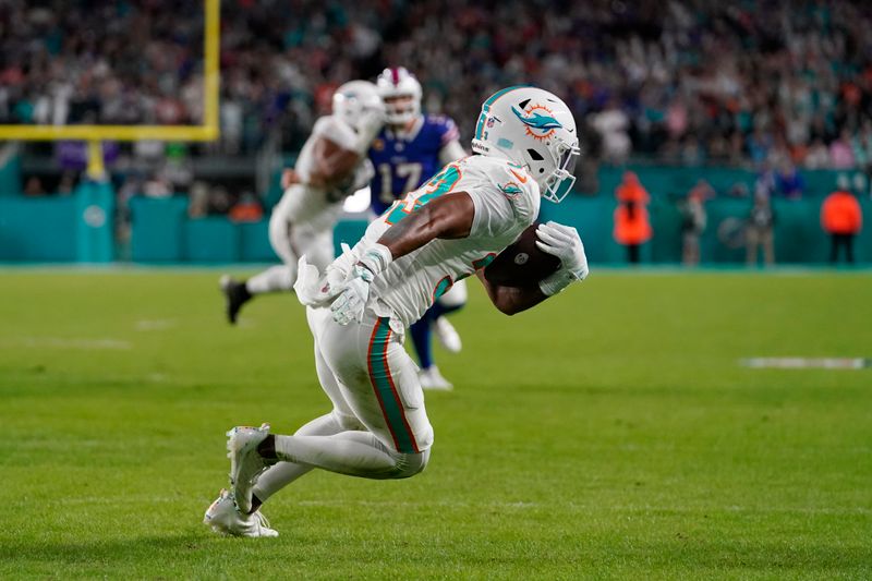 Miami Dolphins cornerback Eli Apple (33) intercepts a pass in the end zone thrown by Buffalo Bills quarterback Josh Allen during the first half of an NFL football game, Sunday, Jan. 7, 2024, in Miami Gardens, Fla. (AP Photo/Lynne Sladky)