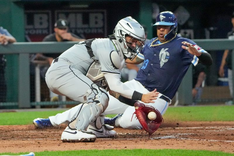 Jul 19, 2024; Kansas City, Missouri, USA; Chicago White Sox catcher Korey Lee (26) misses the tag as Kansas City Royals catcher Salvador Perez (13) scores in the fifth inning at Kauffman Stadium. Mandatory Credit: Denny Medley-USA TODAY Sports