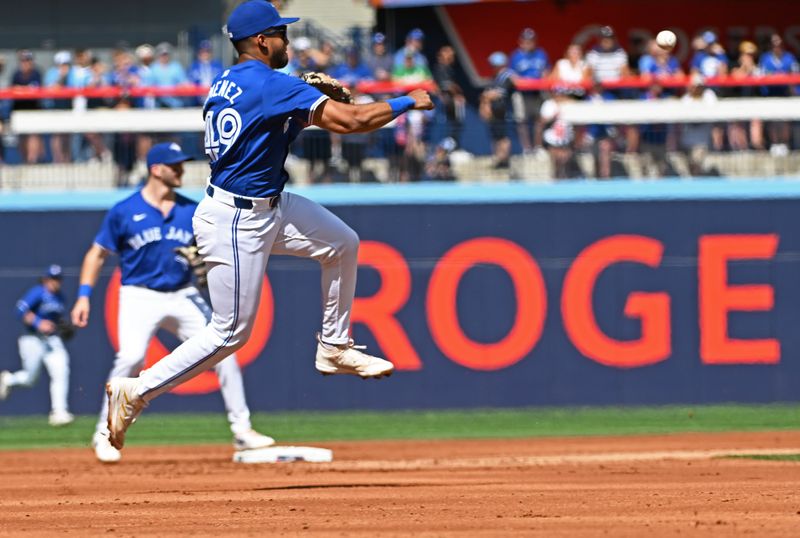 Aug 10, 2024; Toronto, Ontario, CAN; Oakland Athletics infielder Leo Jiménez (49) fields a ground ball in the first inning against the Oakland Athletic at Rogers Centre. Mandatory Credit: Gerry Angus-USA TODAY Sports