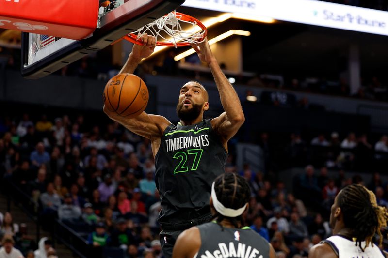 MINNEAPOLIS, MINNESOTA - MARCH 01: Rudy Gobert #27 of the Minnesota Timberwolves dunks the ball against the Sacramento Kings in the third quarter at Target Center on March 01, 2024 in Minneapolis, Minnesota. The Kings defeated the Timberwolves 124-120 in overtime. NOTE TO USER: User expressly acknowledges and agrees that, by downloading and or using this photograph, User is consenting to the terms and conditions of the Getty Images License Agreement. (Photo by David Berding/Getty Images)