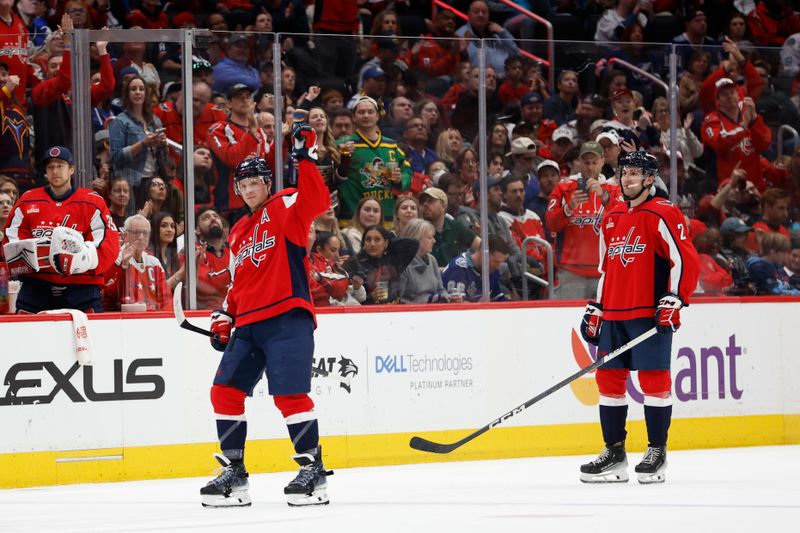 Apr 13, 2024; Washington, District of Columbia, USA; Washington Capitals defenseman John Carlson (74) waves to the crowd after setting the record for franchise goals by a defenseman after a goal against the Tampa Bay Lightning in the third period at Capital One Arena. Mandatory Credit: Geoff Burke-USA TODAY Sports