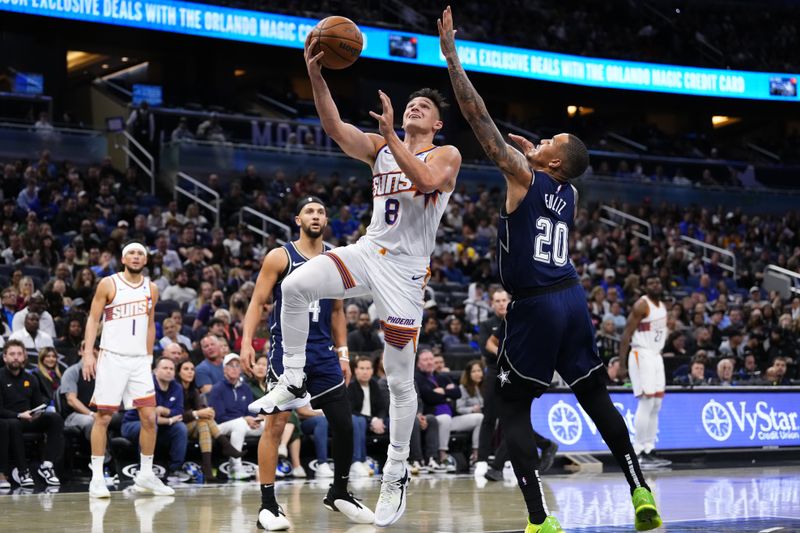 ORLANDO, FLORIDA - JANUARY 28: Grayson Allen #8 of the Phoenix Suns goes up for a shot against Markelle Fultz #20 of the Orlando Magic during the first quarter at Kia Center on January 28, 2024 in Orlando, Florida. NOTE TO USER: User expressly acknowledges and agrees that, by downloading and or using this photograph, User is consenting to the terms and conditions of the Getty Images License Agreement. (Photo by Rich Storry/Getty Images)