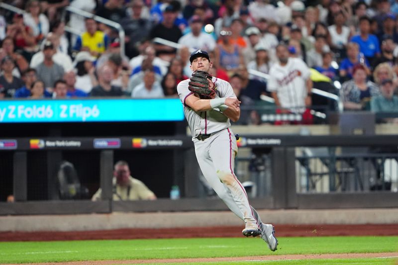 Jul 25, 2024; New York City, New York, USA; Atlanta Braves third baseman Austin Riley (27) throws out New York Mets catcher Francisco Alvarez (not pictured) after fielding a ground ball during the fifth inning at Citi Field. Mandatory Credit: Gregory Fisher-USA TODAY Sports