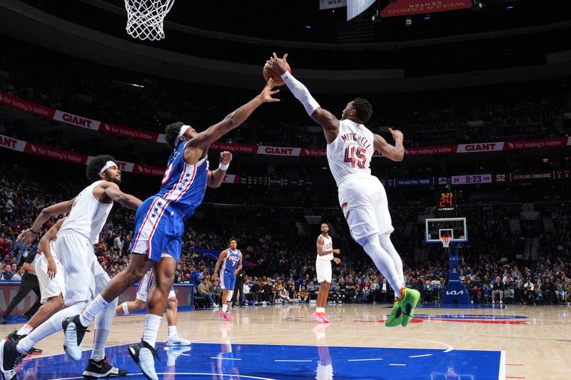 PHILADELPHIA, PA - NOVEMBER 13: Donovan Mitchell #45 of the Cleveland Cavaliers goes after the rebound during the game against the Philadelphia 76ers on November 13, 2024 at the Wells Fargo Center in Philadelphia, Pennsylvania NOTE TO USER: User expressly acknowledges and agrees that, by downloading and/or using this Photograph, user is consenting to the terms and conditions of the Getty Images License Agreement. Mandatory Copyright Notice: Copyright 2024 NBAE (Photo by Jesse D. Garrabrant/NBAE via Getty Images)