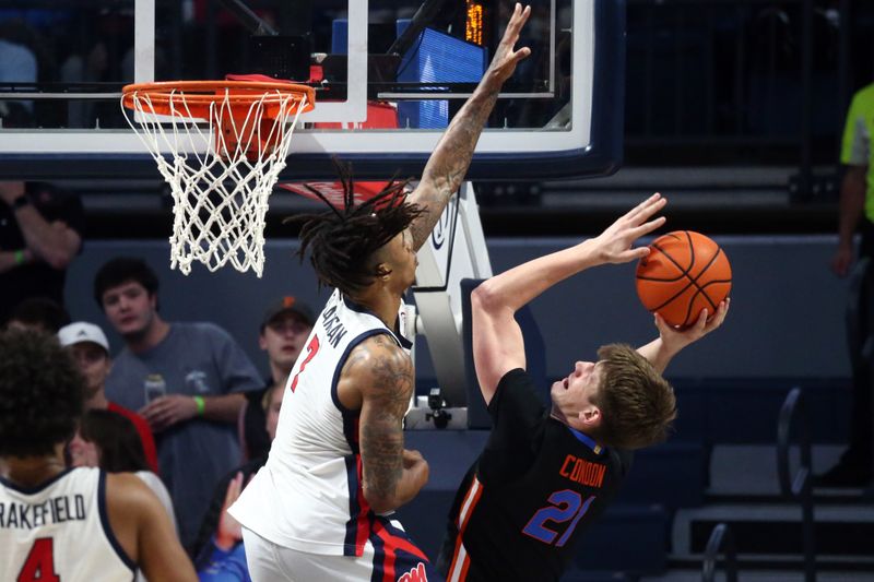 Jan 10, 2024; Oxford, Mississippi, USA; Mississippi Rebels guard Allen Flanigan (7) blocks the shot of Florida Gators forward/center Alex Condon (21) during the second half at The Sandy and John Black Pavilion at Ole Miss. Mandatory Credit: Petre Thomas-USA TODAY Sports