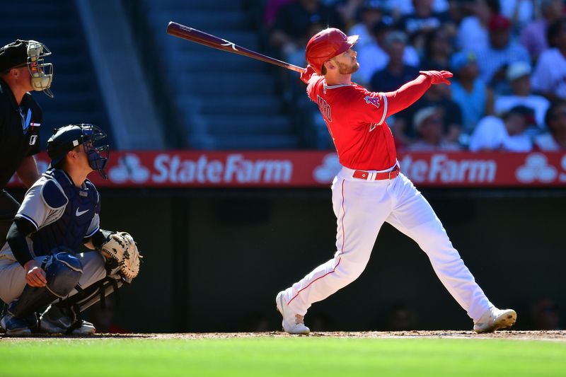 Jul 19, 2023; Anaheim, California, USA; Los Angeles Angels left fielder Taylor Ward (3) hits a two run home run against the New York Yankees during the first inning at Angel Stadium. Mandatory Credit: Gary A. Vasquez-USA TODAY Sports