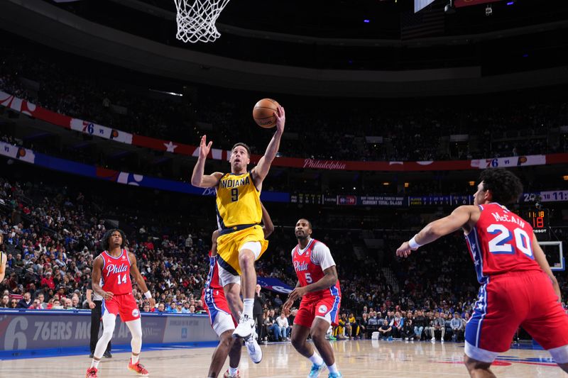 PHILADELPHIA, PA - DECEMBER 13: T.J. McConnell #9 of the Indiana Pacers drives to the basket during the game against the Philadelphia 76ers on December 13, 2024 at the Wells Fargo Center in Philadelphia, Pennsylvania NOTE TO USER: User expressly acknowledges and agrees that, by downloading and/or using this Photograph, user is consenting to the terms and conditions of the Getty Images License Agreement. Mandatory Copyright Notice: Copyright 2024 NBAE (Photo by Jesse D. Garrabrant/NBAE via Getty Images)