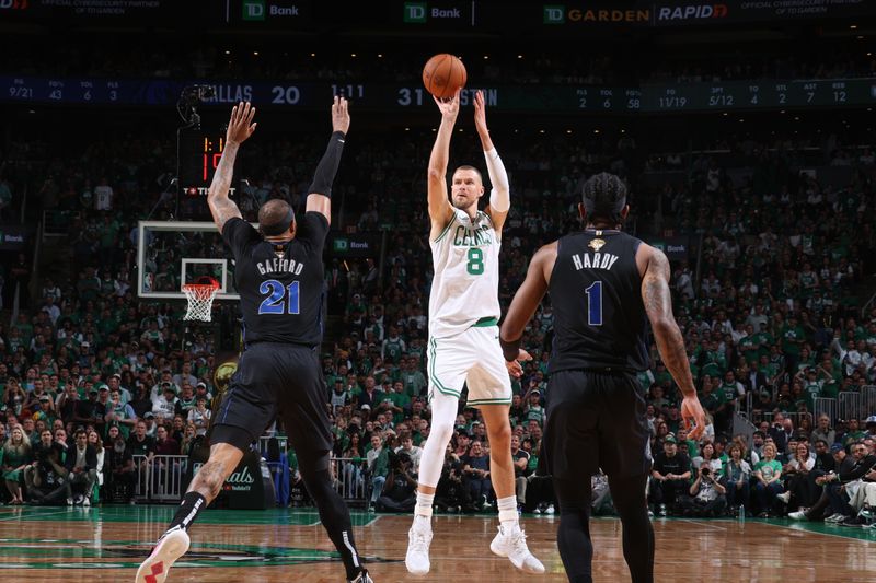 BOSTON, MA - JUNE 6: Kristaps Porzingis #8 of the Boston Celtics shoots a three point basket against the Dallas Mavericks during Game 1 of the 2024 NBA Finals on June 6, 2024 at the TD Garden in Boston, Massachusetts. NOTE TO USER: User expressly acknowledges and agrees that, by downloading and or using this photograph, User is consenting to the terms and conditions of the Getty Images License Agreement. Mandatory Copyright Notice: Copyright 2024 NBAE  (Photo by Nathaniel S. Butler/NBAE via Getty Images)