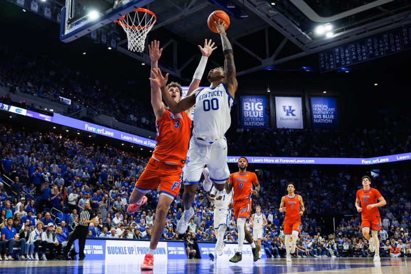Mar 7, 2026; Lexington, Kentucky, USA; Kentucky Wildcats guard Otega Oweh (00) attempts a layup against Florida Gators center Micah Handlogten (3) during the second half  at Rupp Arena at Central Bank Center. Mandatory Credit: Jordan Prather-Imagn Images